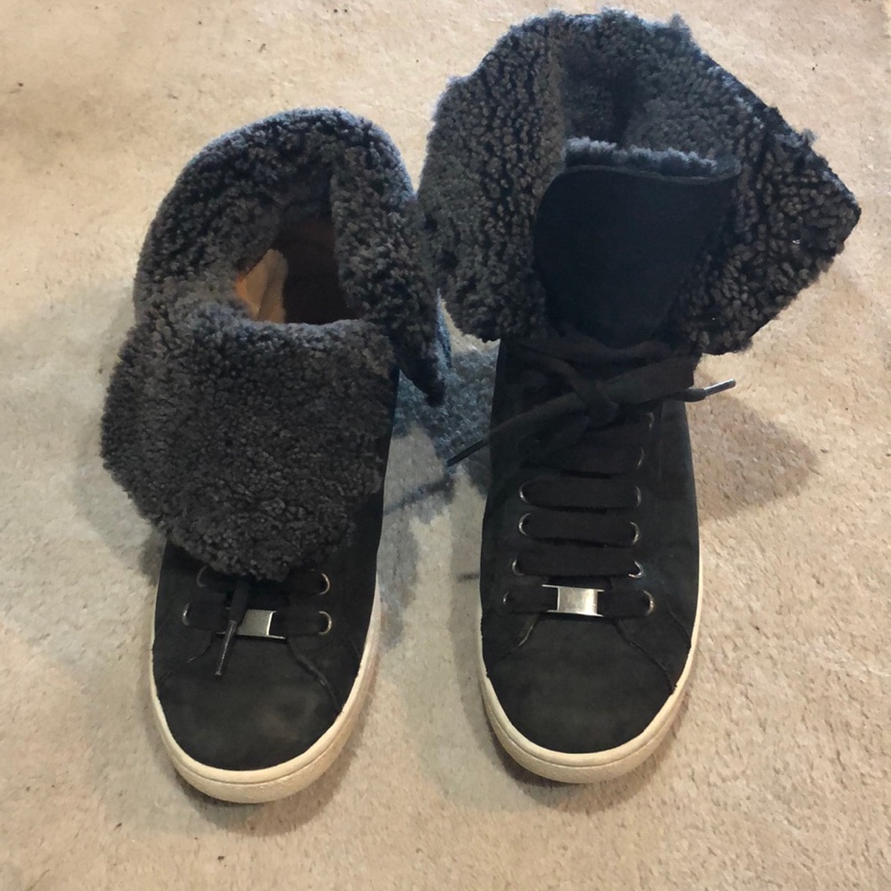 Black Ugg shoe with dark gray sheep skin inside